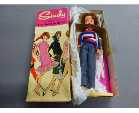 Boxed 1960's 1st edition Sindy doll with Brunette hair & red hairband in Weekenders outfit with Stand & Bazaar pink booklet