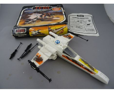 Boxed Star Wars Return of the Jedi X-Wing Fighter vehicle (French) with instructions, box end flap removed but present with i