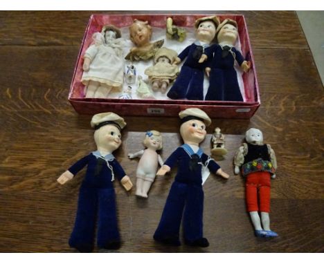 Four Norah Wellings style sailor dolls, Braemar, Iberia, Queen Elizabeth 2 and Uganda, a bisque kewpie doll with jointed arms