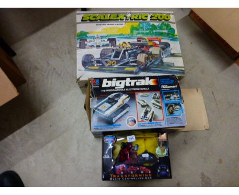 Boxed Scalextric 200 set with 2 slot cars, a boxed MB Big Trak and a boxed r/c transforming car