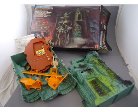 Boxed Mattel Masters of the Universe He-Man Castle Greyskull 3991 appearing to be complete with accessories, box with storage
