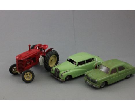 Tin plate West German friction car, a plastic model and a diecast Massey Harris 745 tractor