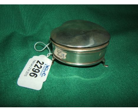 A Silver hall marked Trinket/Pill Box of heart shape with hinged lid and satin lined interior, standing on three splayed feet