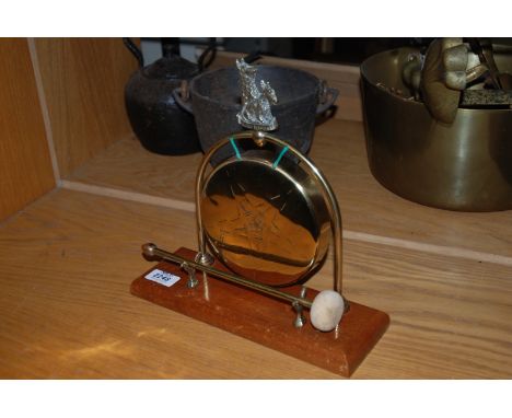 A Brass Dinner Gong with Scotch Terrier