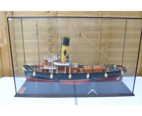 large scale cased static wooden model of the Newcastle registered Tyne Tug "Joffre" in a glass display case. Model has some d