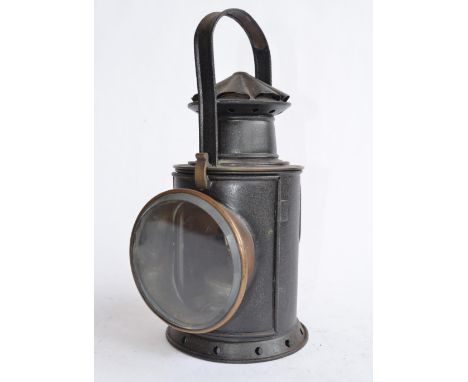 A large railway lamp with lockable rotating lamp mechanism, height to handle top 34cm.No makers marks. 
