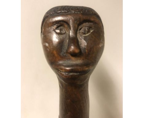 A fruit wood carved swagger stick with engraving of "England, Scotland, Wales and Ireland, The Scotts Guards and dedicated to
