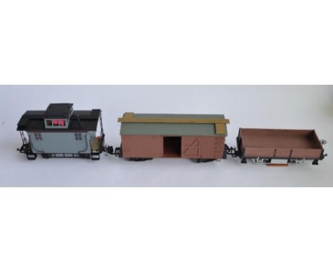 3 G-gauge railway wagons, 1 by Bachmann, 2 by Aristo including a track cleaning wagon. Both brown wagons have been re-painted