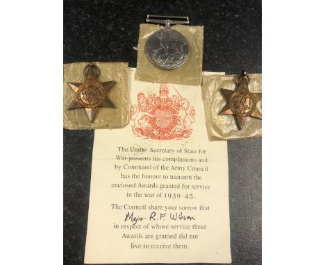 Three medals including 1939 - 45 Star, 1939 - 45 war medal, Italy Star with certificate to Major R. F. Wilson, possibly attri