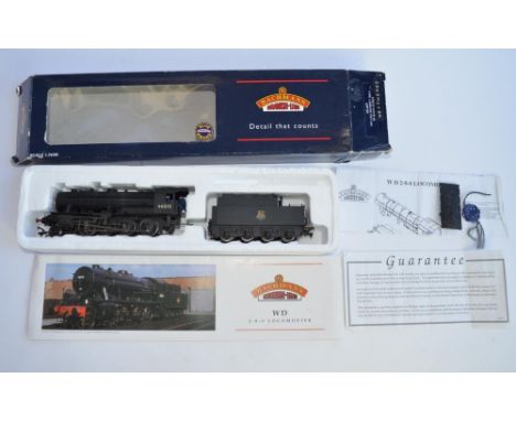 2 OO gauge train models:A boxed weathered Bachmann (32-257) WD 2-8-0 Austerity 90015 BR Black E/Crest. Condition overall good