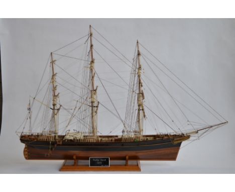 A 1/84 scale full hull model of the tea clipper Cutty Sark. Hand made in wood. Overall length approx 102cm, height from base 