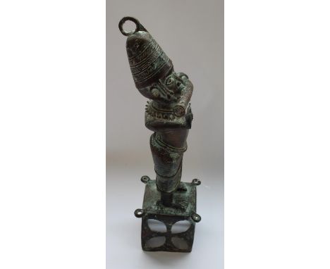 Large Benin bronze figure playing ceremonial pipe 