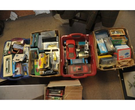 Four boxes containing Corgi, Days Gone By, and Vanguard boxed and unboxed cars 