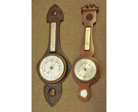 A mahogany android wall barometer and an oak wall barometer with damaged glass (2)
