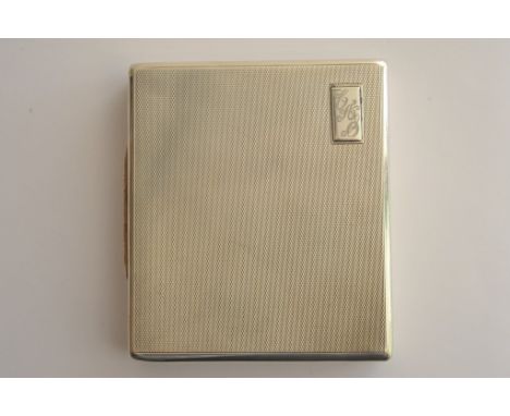 A silver cigarette case of rectangular form