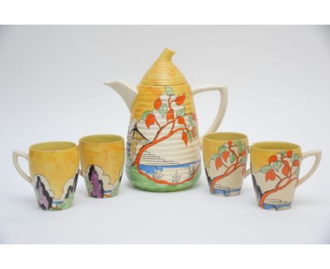 A rare Clarice Cliff 'Japan' pattern coffee set of ribbed shape, comprising coffee pot and four cups. Some damage to most pie