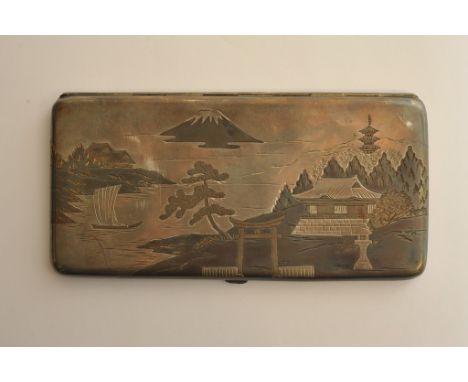A Japanese engraved silver and niello type cigarette case decorated with landscape scenes and Mount Fuji