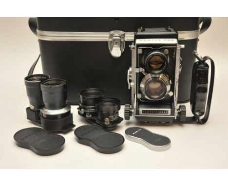 A quality cased Mamiya C33 Professional camera with attached Mamiya-Sekor 1:2.8 f+80mm Seikosha-S lens and two spare lenses c