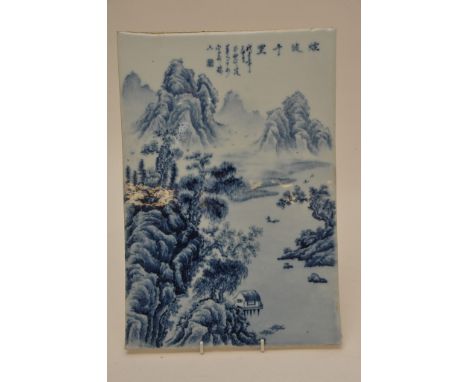 A Chinese republic type porcelain tile panel decorated in blue and white with landscape scenes with Chinese script. Size: 36.