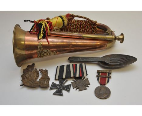 A small collection of militaria including a German iron cross 1813-1914 plus another medal and a bugle