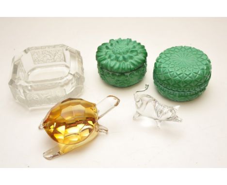 A Lalique style glass ashtray having moulded decoration showing the signs of the Zodiac and two green glass trinket pots, a g