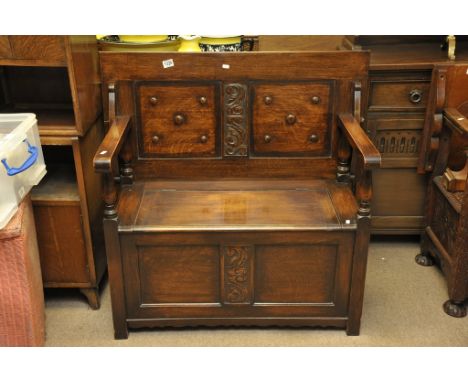 An Oak Monks Bench with carved panels 
