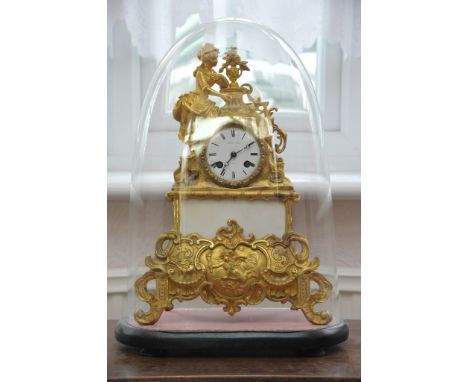 A French late 19th century gilt metal clock the enamel dial with the inscription Potonie Paris . Under a glass dome 