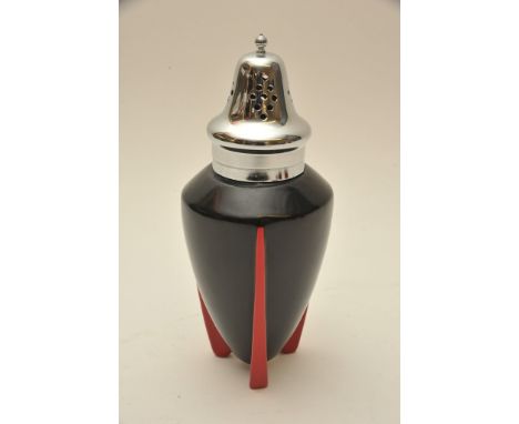 An Art Deco Wilkinson 'Yoo Hoo' pattern sugar sifter with black body on red tripod feet having chrome lid, designed attribute
