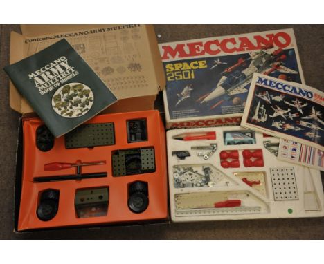Two boxes of Meccano: Space: 2501 Construction Set and the Army Multikit, both with instruction manuals.
