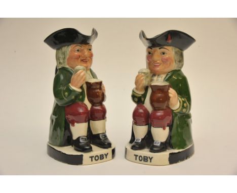 A Crown Devon Toby jug with musical movement with another by Royal Doulton