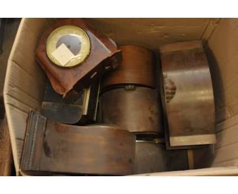 A collection of mantle clocks and empty clock cases in walnut, oak and bakelite (7)