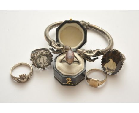 A white metal bangle the ends with neoclassical rams heads. A white metal ring inset with blue John and various other silver 