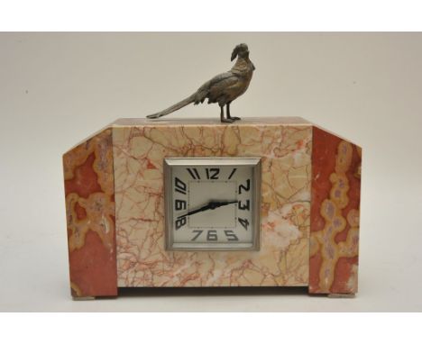 An Art Deco veined marble mantle clock surmounted by a pheasant