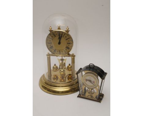 A small Schatz mantle clock, an Anniversary clock and pendulum wall clock