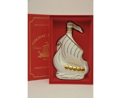 A boxed bottle of Cognac Larsen France in a ceramic bottle 