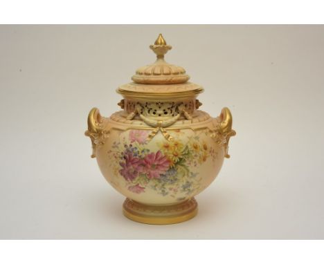 A large Royal Worcester pot pourri hand painted with flowers on a blush ivory ground with gilt details. Height: 34cm