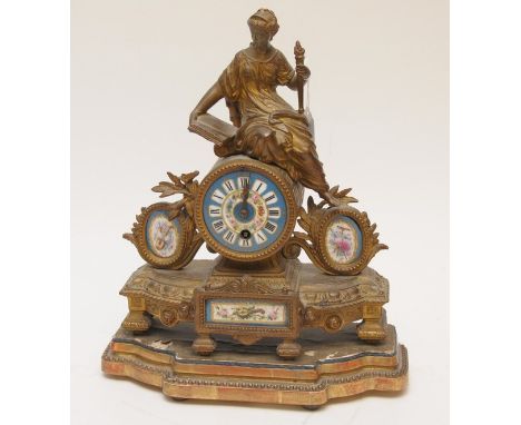 A late 19th century French gilt metal mantle clock with enamel dial and surmounted by a maiden