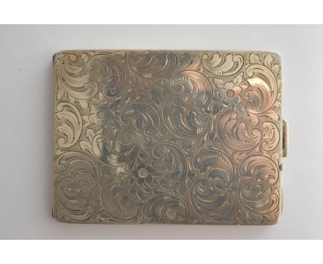 A sterling silver cigarette case with engraved scrolling decoration