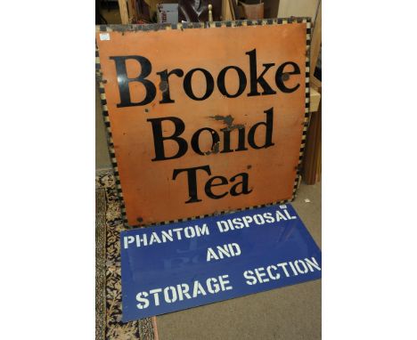 A large vintage Brook Bond Tea enamel sign and an R.A.F. disposal sign for phantom jet fighter planes when obsolete at base 