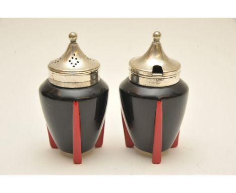 An Art Deco Wilkinson 'Yoo Hoo' pattern part condiment set, comprising a black glazed pepper and mustard pot each on red trip