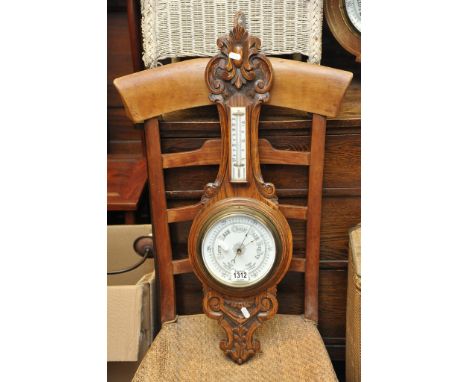 An Oak carved Barometer