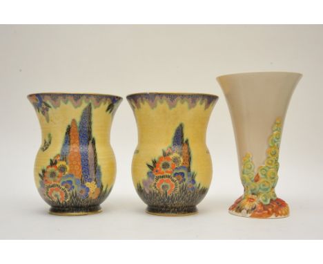 A Clarice Cliff vase with moulded floral decoration and a pair of Crown Devon Art Deco vases  painted and gilded with butterf