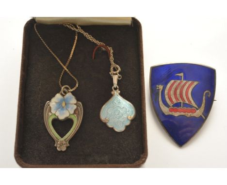 A collection of silver and enamel jewellery comprising a shield shape brooch with longboat emblem by K. Larsen, and two penda