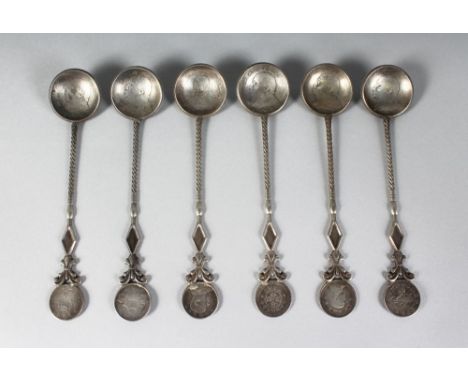 A SET OF SIX CHINESE SILVER COIN SPOONS.