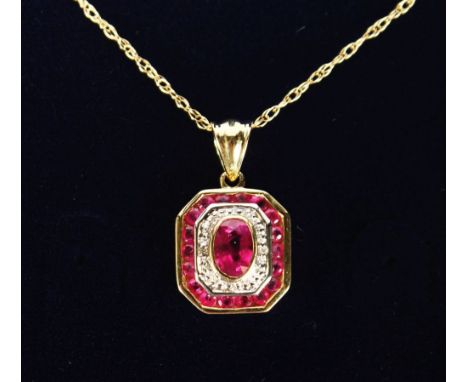 A 9CT GOLD, RUBY AND DIAMOND ART DECO DESIGN PENDANT AND CHAIN.