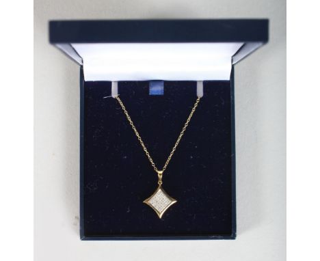 A 9CT GOLD PAVE SET DIAMOND PENDANT AND CHAIN.