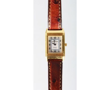 A GOOD 18K GOLD JAEGER LECOULTRE "REVERSO" WRISTWATCH with leather strap.