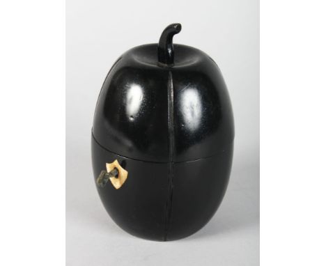 A WOODEN EBONISED MELON TEA CADDY. 7ins high.