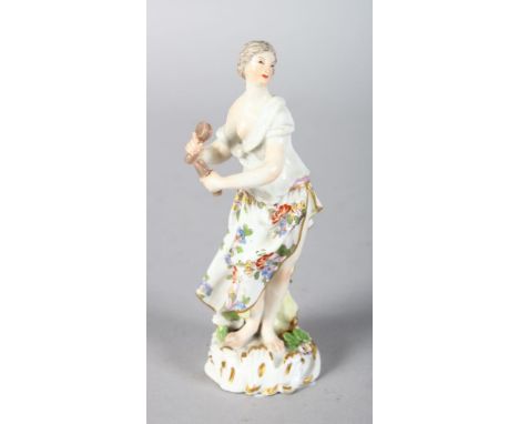 AN 18TH CENTURY MEISSEN MODEL OF A MUSE PLAYING THE CASTINETS, blue crossed swords to back of base.