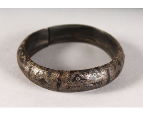 AN EARLY HORN AND SILVER BANGLE.